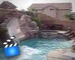 Dog loves the pool slide!